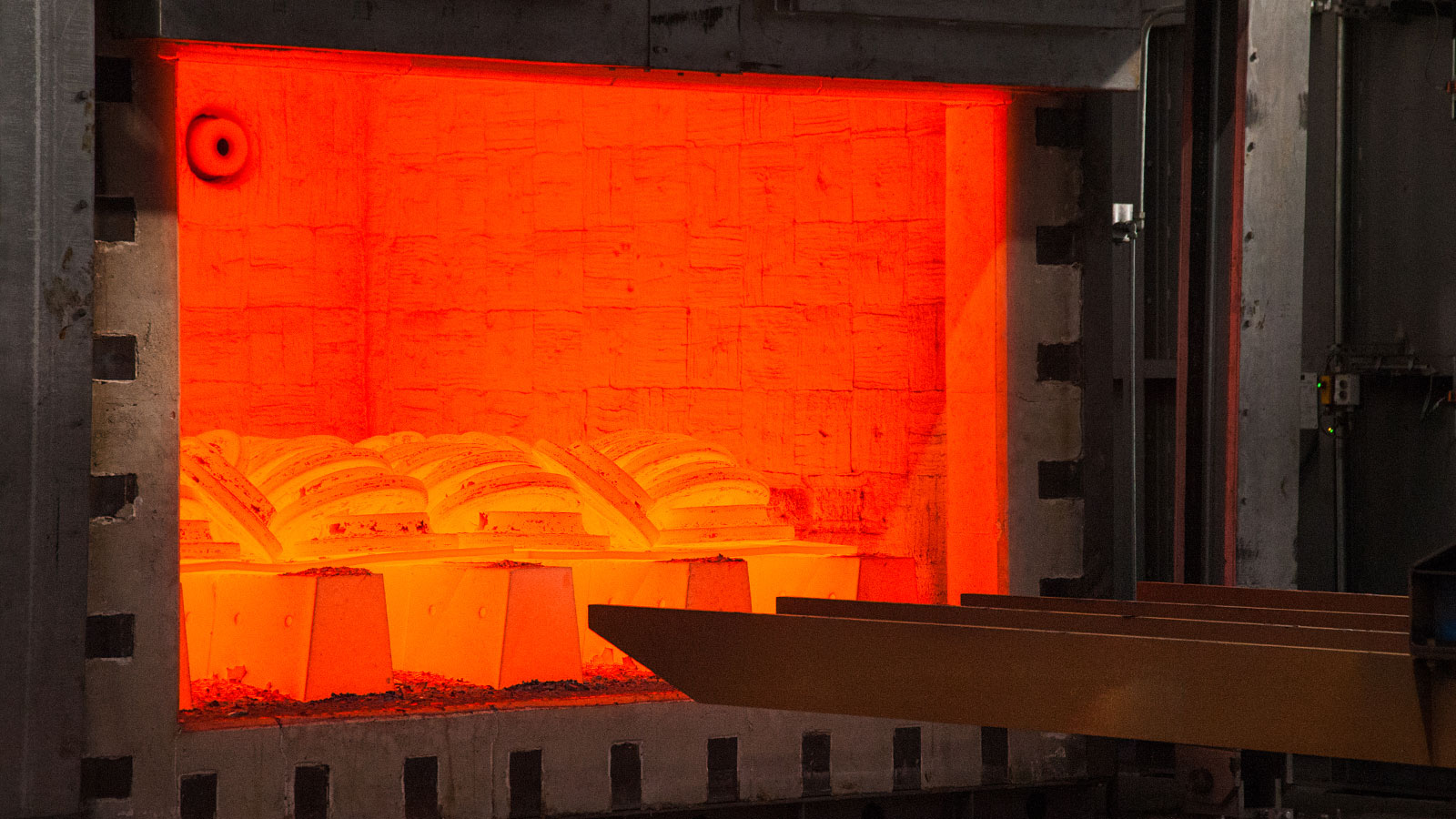 Opening a Heat Treat furnance to get the materials.