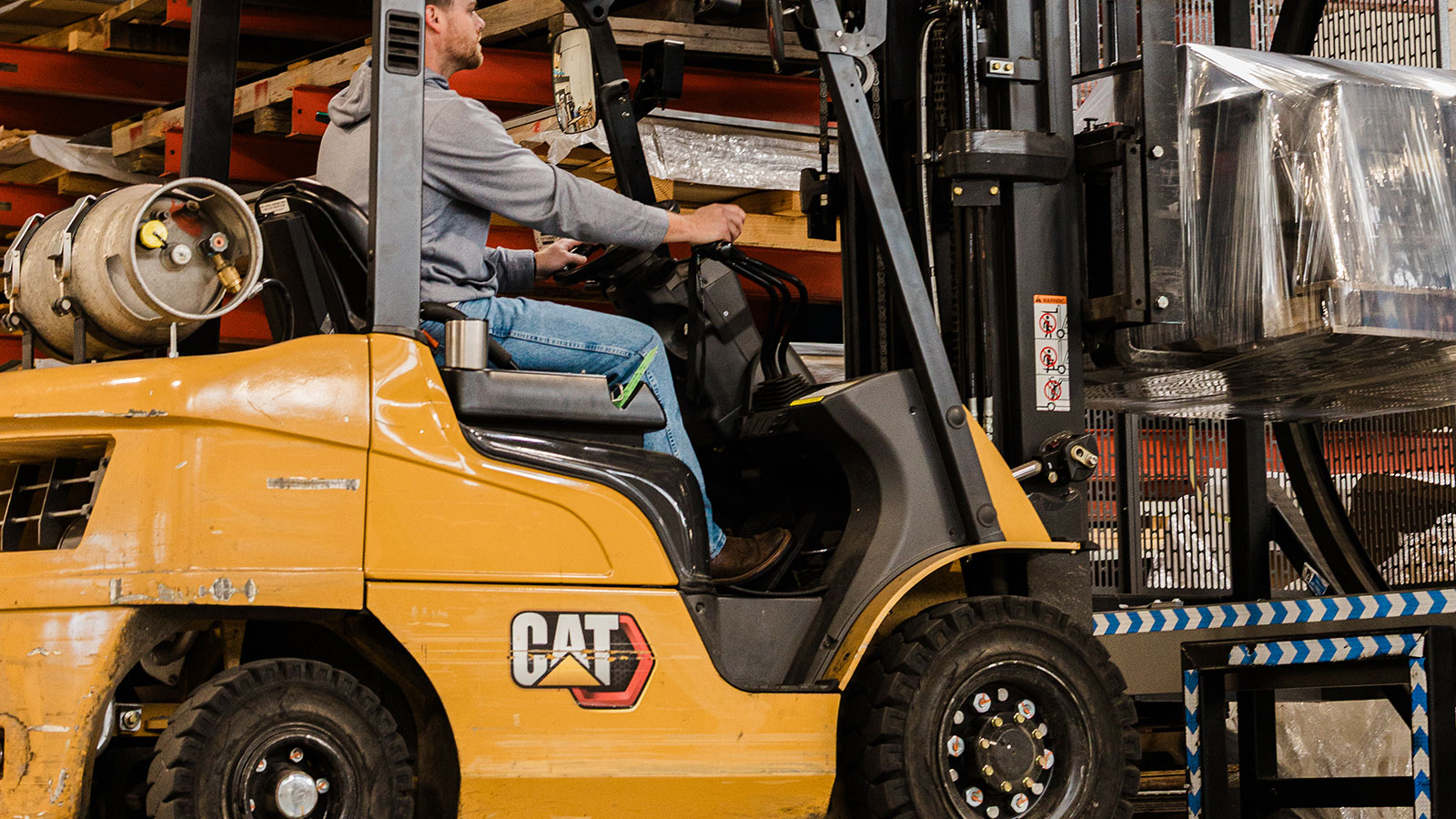 Using a forklift to get a pallet wrapped.