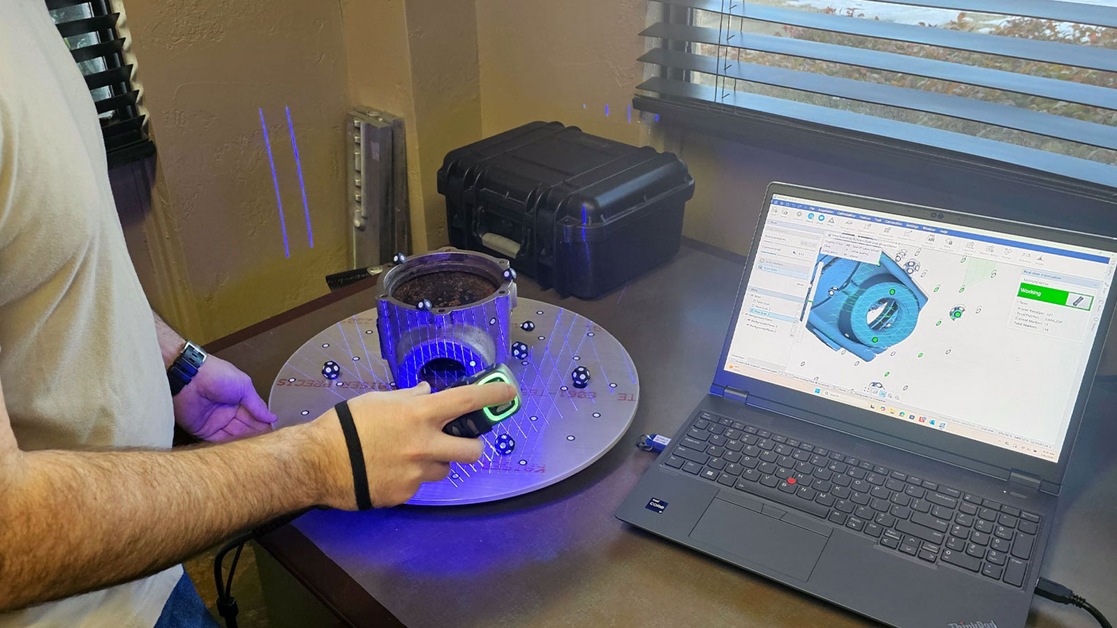 SIMSCAN Handheld 3D Scanner being used to scan a part.