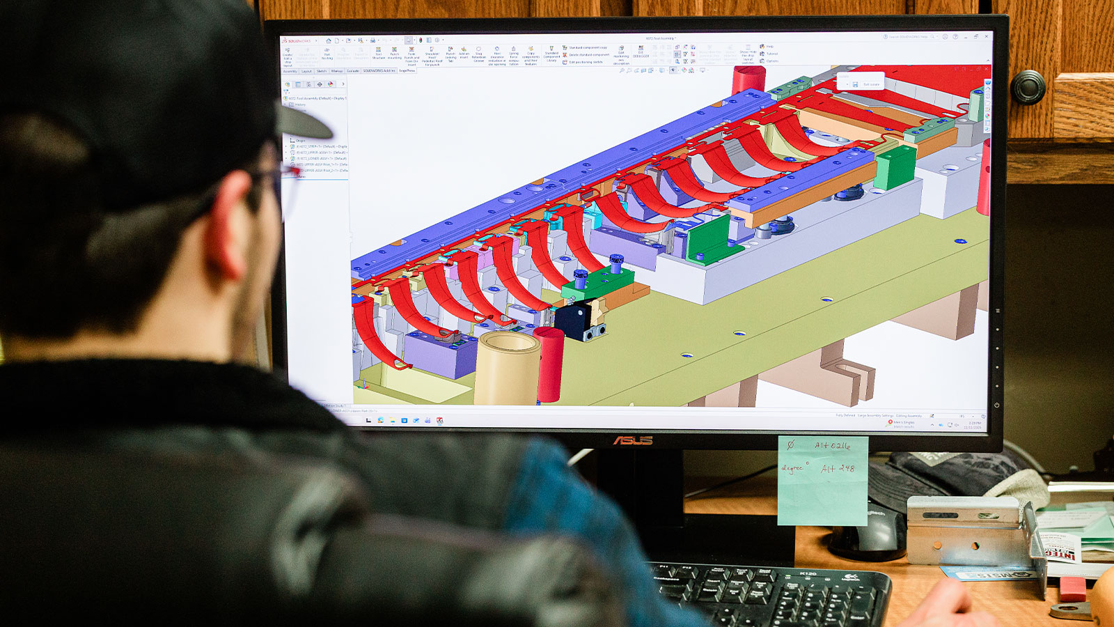 Using the engineering software, a JTD engineer is finishing a part design.