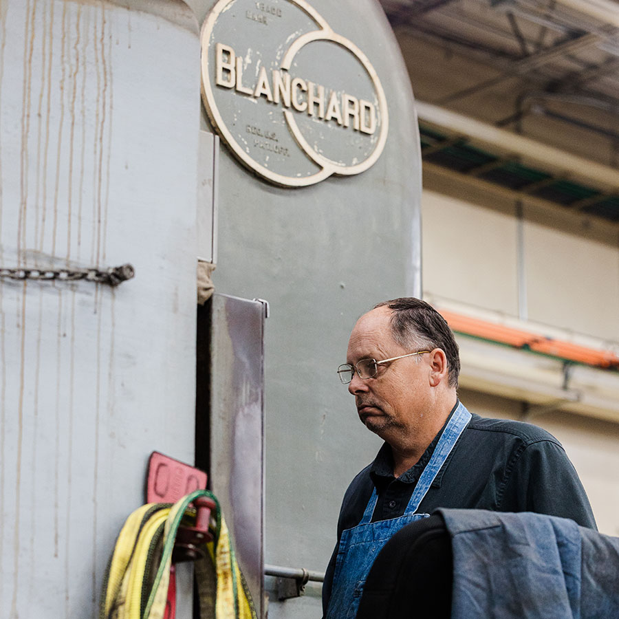 Jonesboro Tool and Die craftsman using a blanchard grinder.