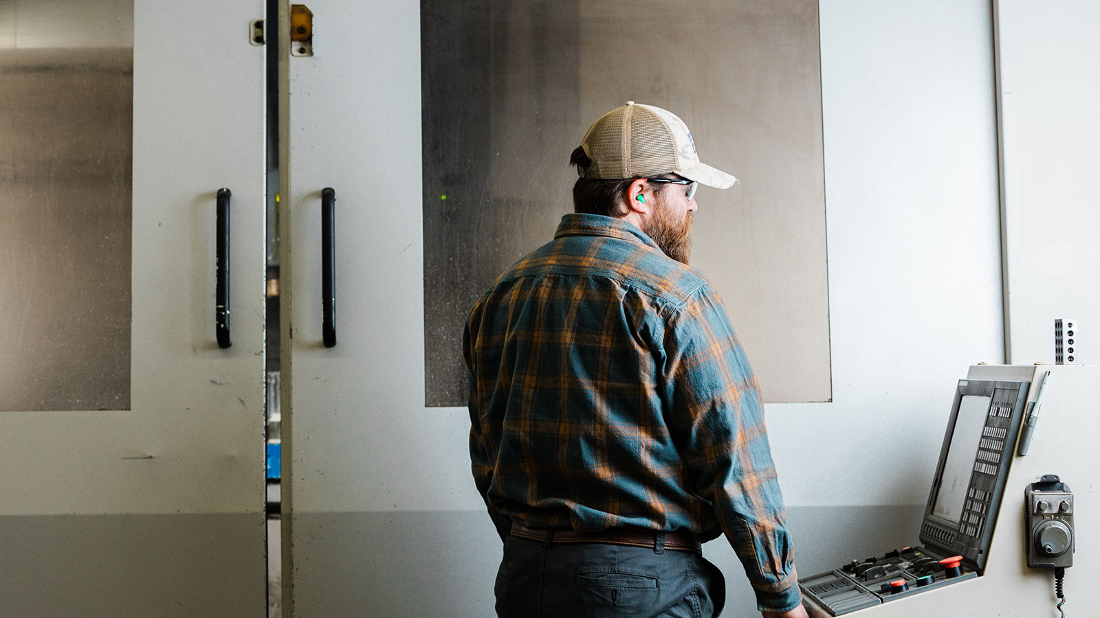 A Jonesboro Tool and die employee working on the Okuma CNC Mill.