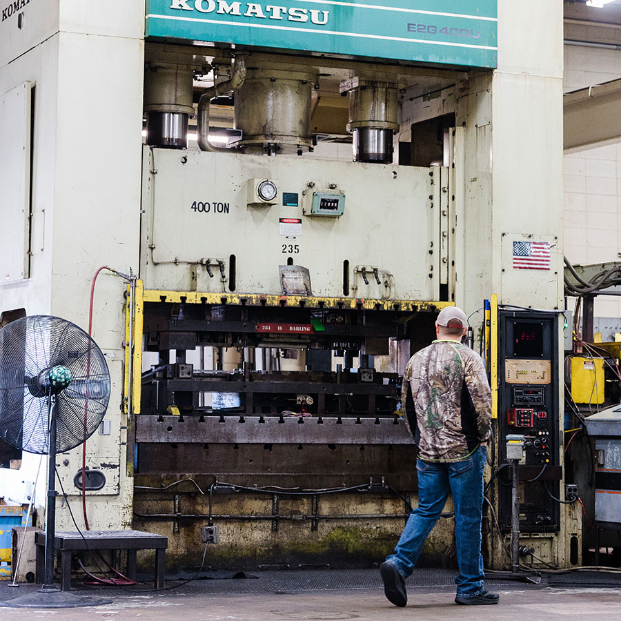 JTD Employee working on the Komatsu 440 Punch press machine.