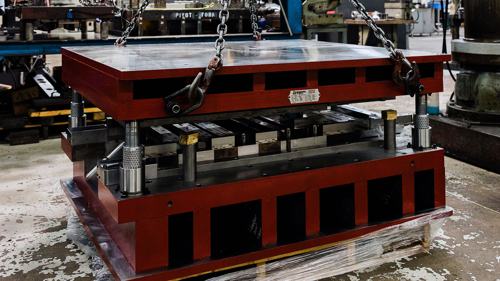 Jonesboro Tool and Die employees building a die.