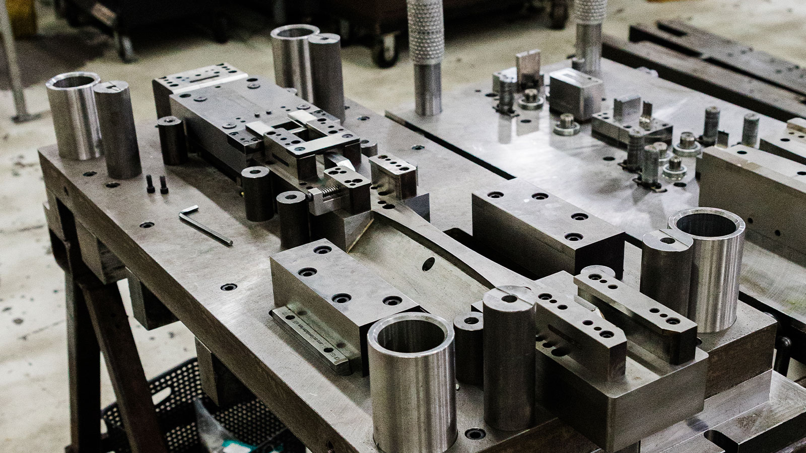 A die build pulled apart sitting on a table at JTD.