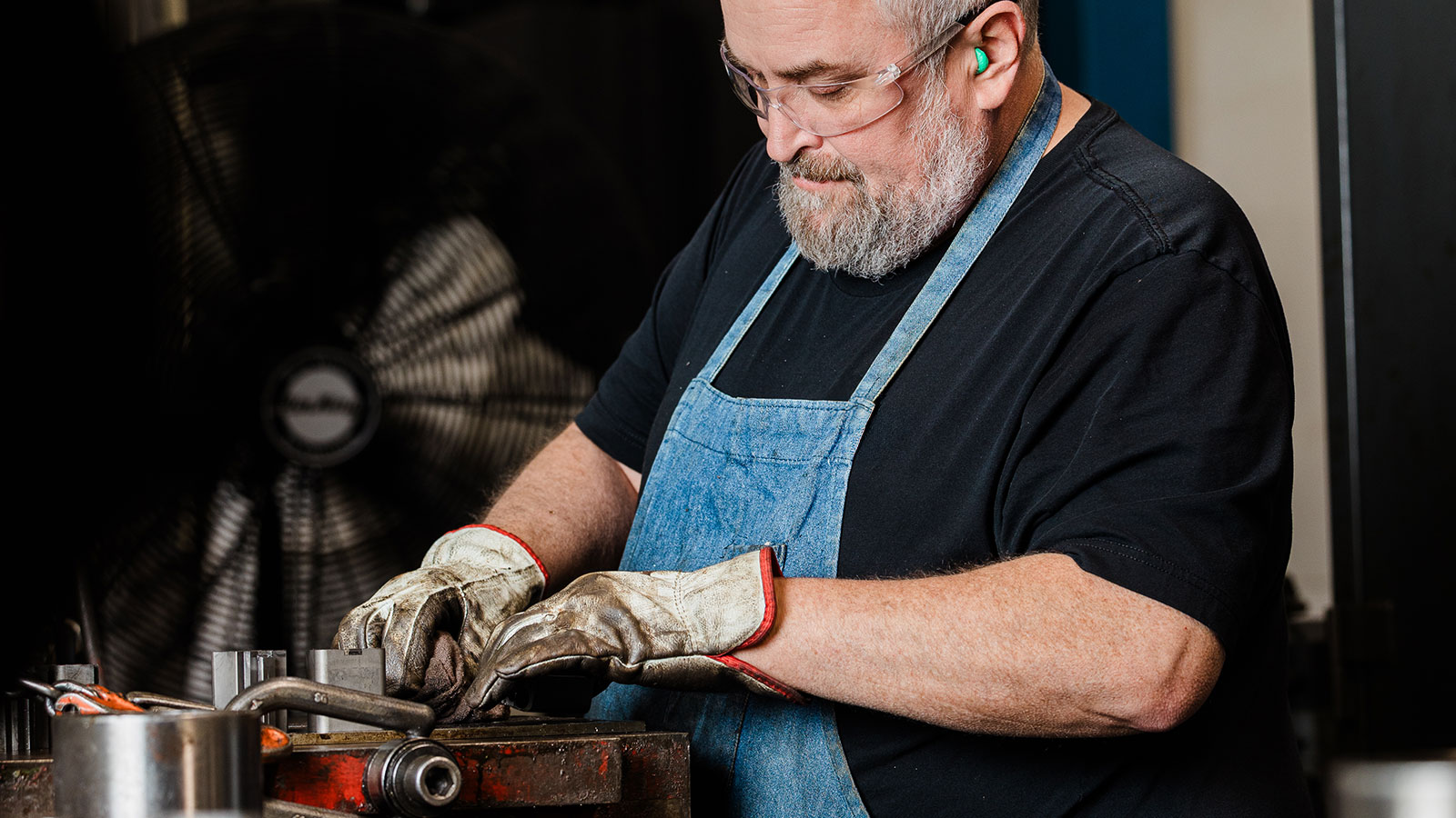 A JTD employee repairing a die mold.