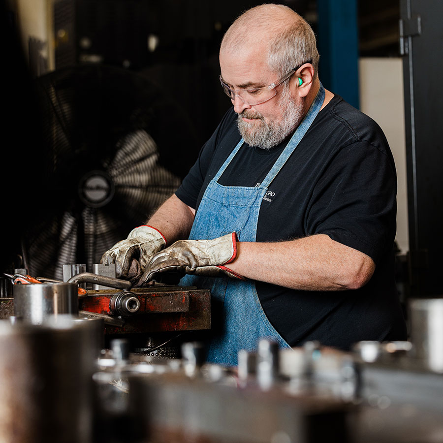 JTD Craftsman making a repair to a die mold.