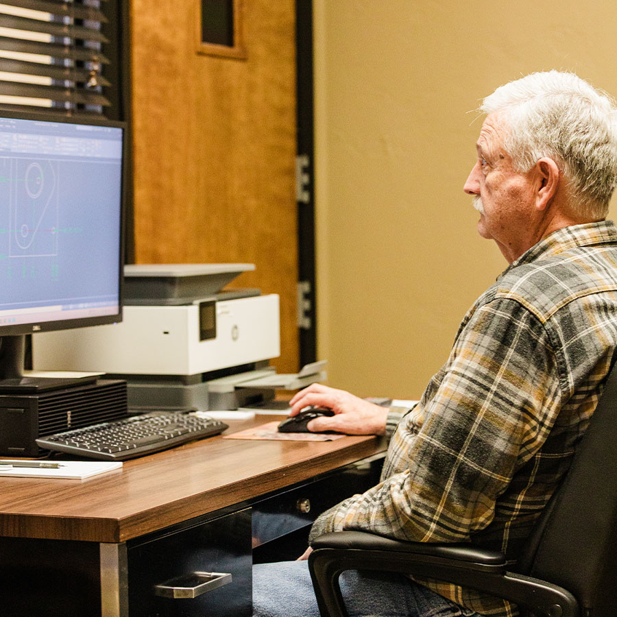 Mr. Jimmy working in the engineering department at Jonesboro Tool and Die.