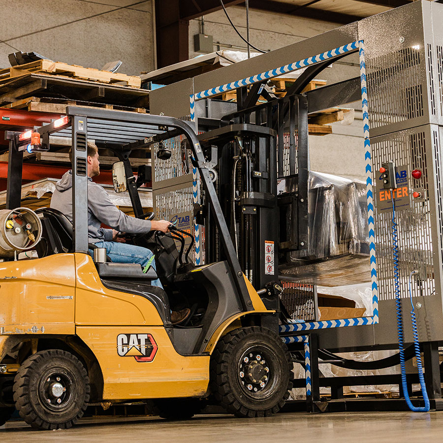 Zack at JTD working on the forklift in the shipping department.