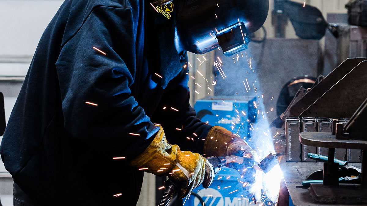 Welder at JTD working on a part.