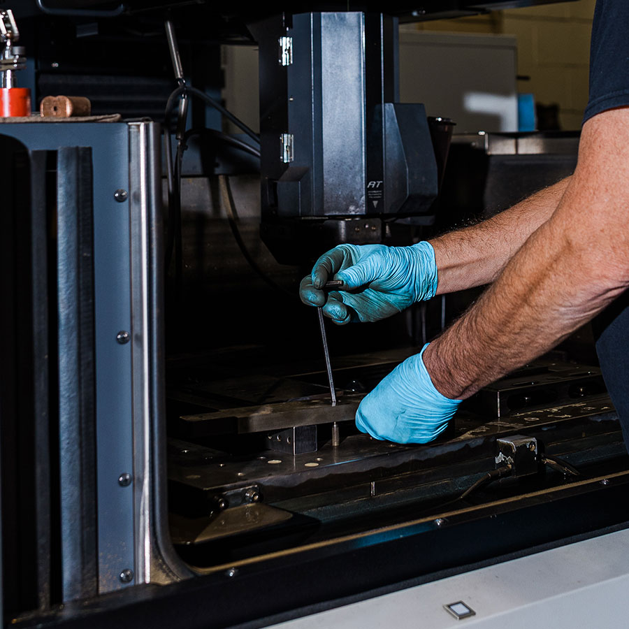 JTD craftsman working on making die parts.